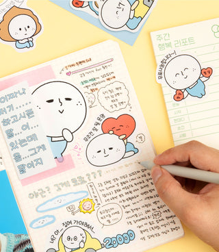 Cartoon character sticker sheet with speech bubbles and a hand holding a pen