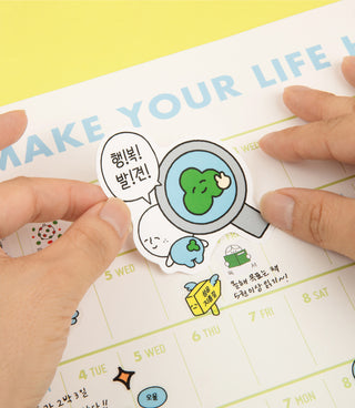 Cartoon character sticker placed on a planner calendar page