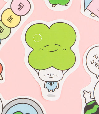 Close-up of a green tree-shaped cartoon character sticker