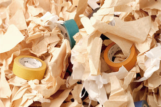Upcycle tape rolls in pastel yellow, lavender, and rose pink on crinkled paper