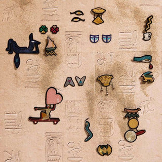Embroidered eye patch set with colorful designs on a beige backing
