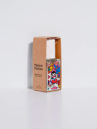 Eau de parfum bottle in brown carton with colorful comic label