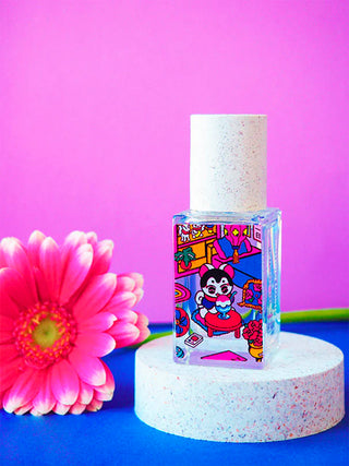 Eau de parfum bottle with colorful comic-style label on clear glass vial