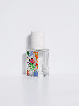 15 ml eau de parfum bottle with speckled cap and colorful label, front view