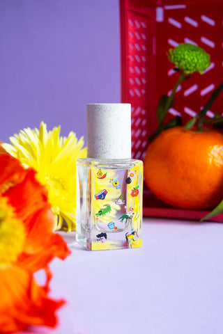 15ml eau de parfum bottle with cylindrical clear glass and colorful illustrated label