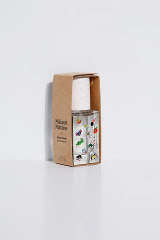 Eau de parfum bottle with kraft cardboard box, speckled cap, colorful label