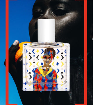 Maison Matine Eau de parfum bottle held in front of a person’s face
