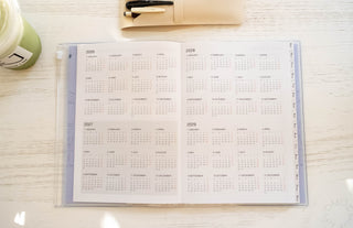 Open calendar planner insert with monthly grids for 2026–2029, 2027 preview