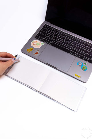 Open landscape dot grid notebook with dotted pages and clear covers