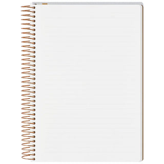 A5 spiral notebook, open with white ruled paper and copper ring spine