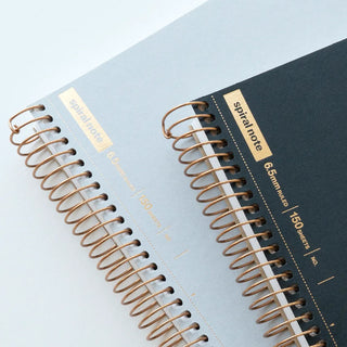 Black A5 spiral notebook with 6.5mm ruled lines and copper ring binding