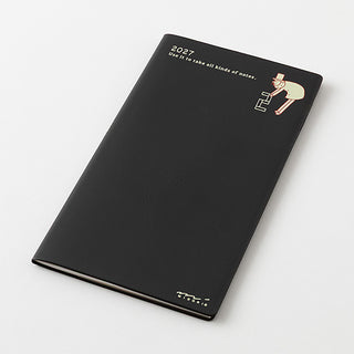 Black slim 2027 planner booklet with textured cover and nutcracker-style icon