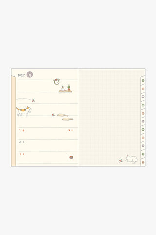 Open 2027 weekly planner pages with cats illustration and ruled date area.
