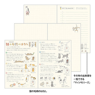 Planner spread with handwritten-note pages and small cat drawings.