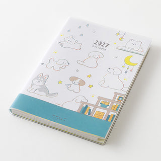Midori 2027 datebook planner, angled view of white cover with animal scenes and blue strip