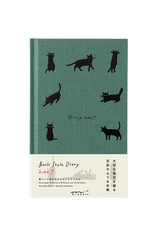 Green cat-print monthly block and weekly diary planner, front cover with cats