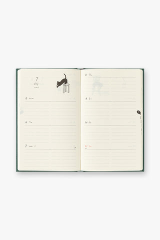 Open weekly and monthly diary planner pages with lined sections and cat icons