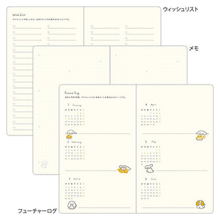 Open planner spreads with monthly grid and handwritten-style day sections