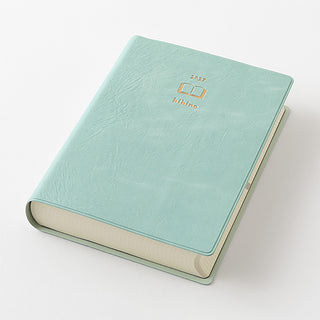Blue-green A6 two-page-a-day planner angled cover with gold Hibino logo