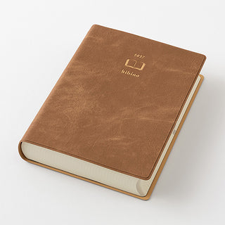 Camel-brown A6 two-page-a-day planner with rounded corners and embossed logo