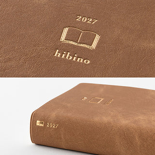 Camel-brown A6 two-page-a-day planner cover detail with gold Hibino emblem