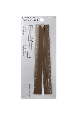Brown aluminum multi ruler in retail packaging, with visible instruction diagram