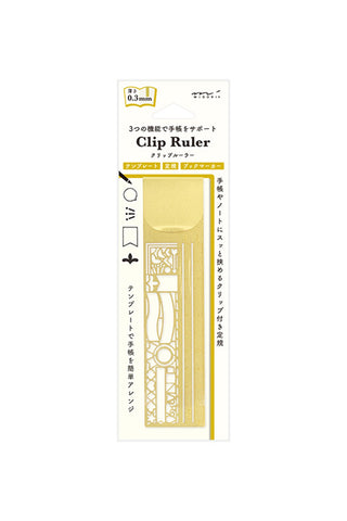 Clip ruler in gold with decorative cutout design and printed measurement markings