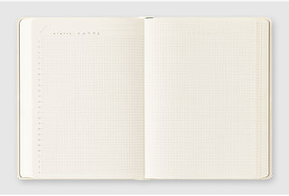Open A6 diary showing two interior pages with dotted grid layout