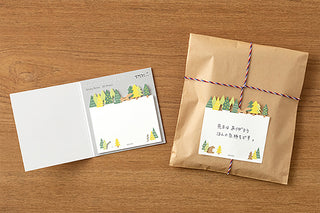 Forest tree sticky notes set with matching illustrated sheets on tabletop