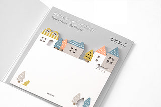 Sticky notes with town skyline illustrations on the top sheet