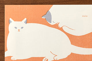Cat envelope front with orange-and-white cat illustration and stamp text area