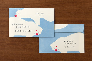 Two polar bear envelopes with printed address text on pale blue-and-white design