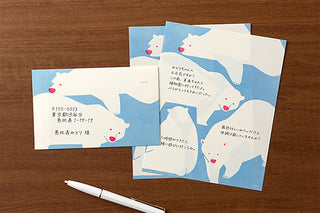 Polar bear letter paper pad with matching envelopes on wooden table
