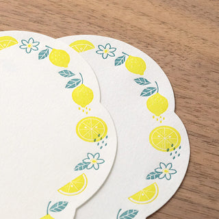 Lemon wreath die-cut letter card with small flowers, lemons, and leaf details