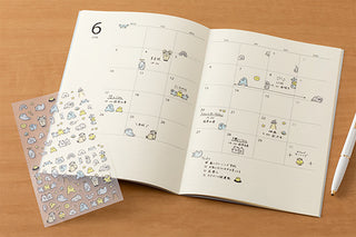 Little Monsters sticker set with animal icons on a planner page spread
