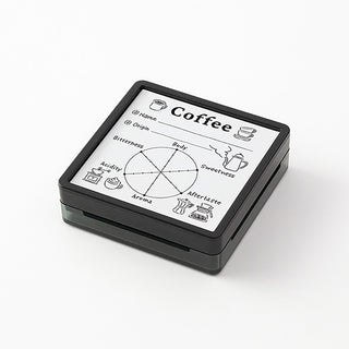 Black block coffee stamp with flavor wheel showing sweetness, acidity, bitterness, aroma