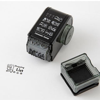 Black paintable rotary stamp with clear ink base and dial displaying list icons