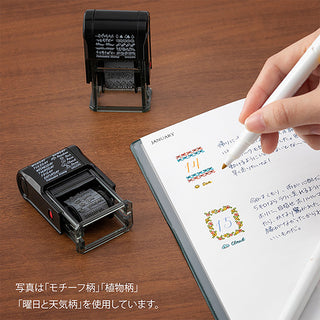 Black rotary stamp and white paper cards with small numbered floral stamp marks.