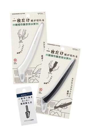 Assorted Midori scrapbook cutters and refill blade pack in retail packaging