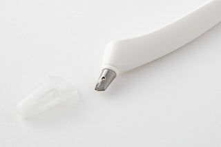 Close-up of metal cutting blade on a white scrapbook cutter