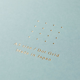 Light aqua notebook cover with dotted pattern and printed "A5 size / Made in Japan"