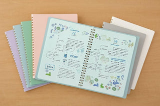 A5 spiral notebooks assorted colors, several pastel covers with gold coil rings