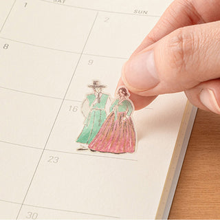 Planner page with colorful vintage Korea-themed sticker of two people in dresses