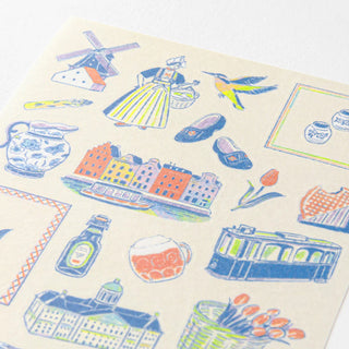 Close-up of Dutch-themed planner sticker sheet with windmill, canal, buildings, and shoes