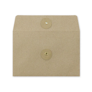 Brown kraft envelope front with flap and two circular button closure elements, minimalist.