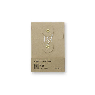 Brown kraft envelope with flap and round button closure; two tied tags on front.