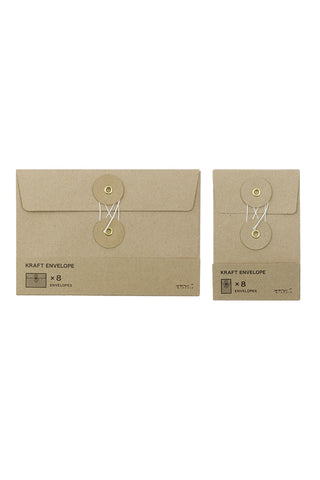 Brown kraft envelopes set with flap and circular button-style closure, tied with string.