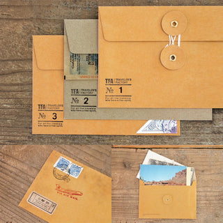 Brown kraft envelope set with flap closure and attached tag details; multiple envelopes shown.