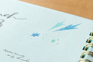 Close-up of starry sky transfer sticker designs with blue stars and sparkles