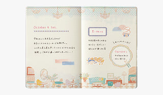 B6 dot grid notebook open, illustrated room scene with small text blocks